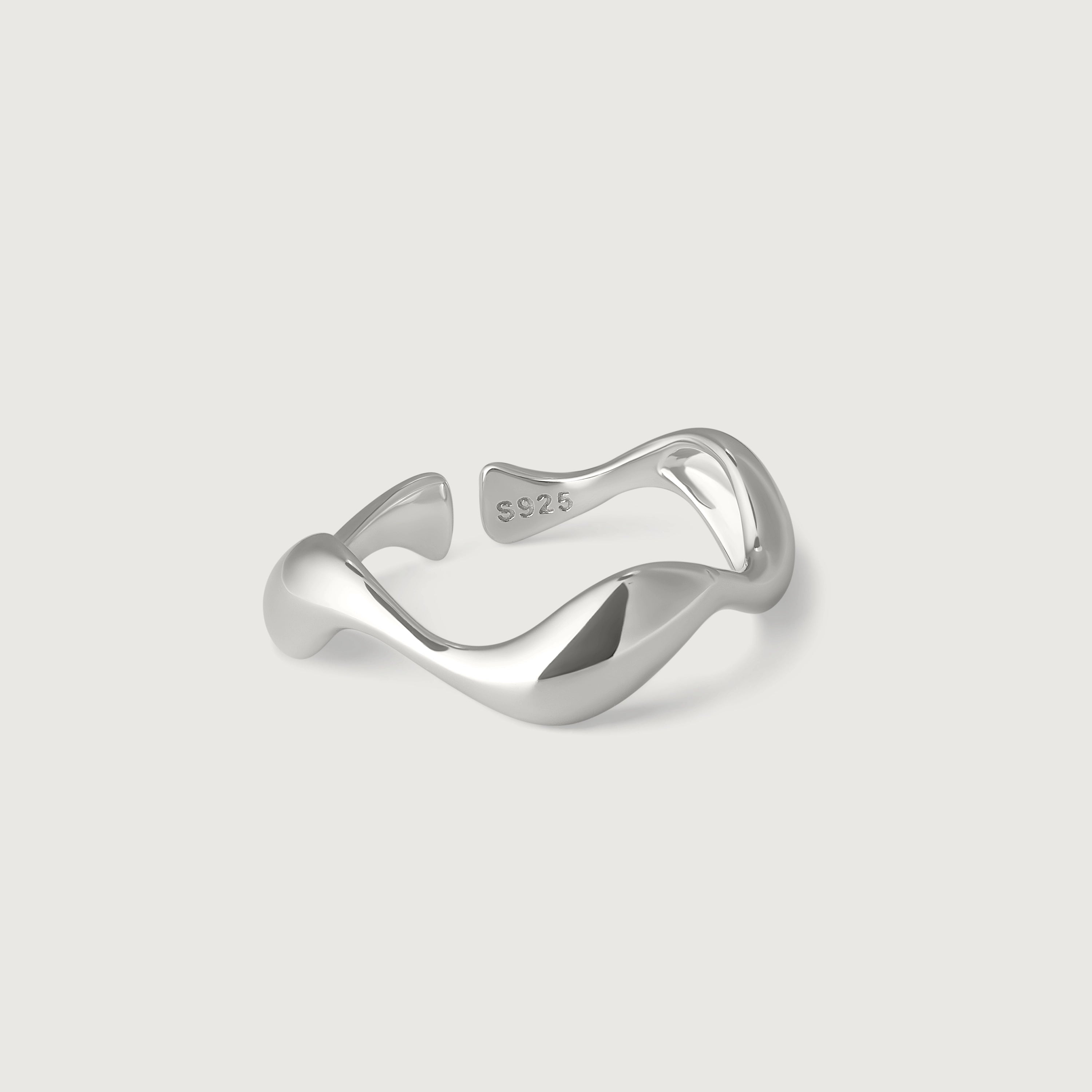 A sleek silver ring with an undulating design, crafted from sterling silver with a stamped hallmarked of S925.