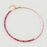  Rose quartz and pearl beaded necklace in gold, with one half strung with imitation pearl rice beads and the other half with faceted rose quartz beads graduating from soft blush to deep pink.