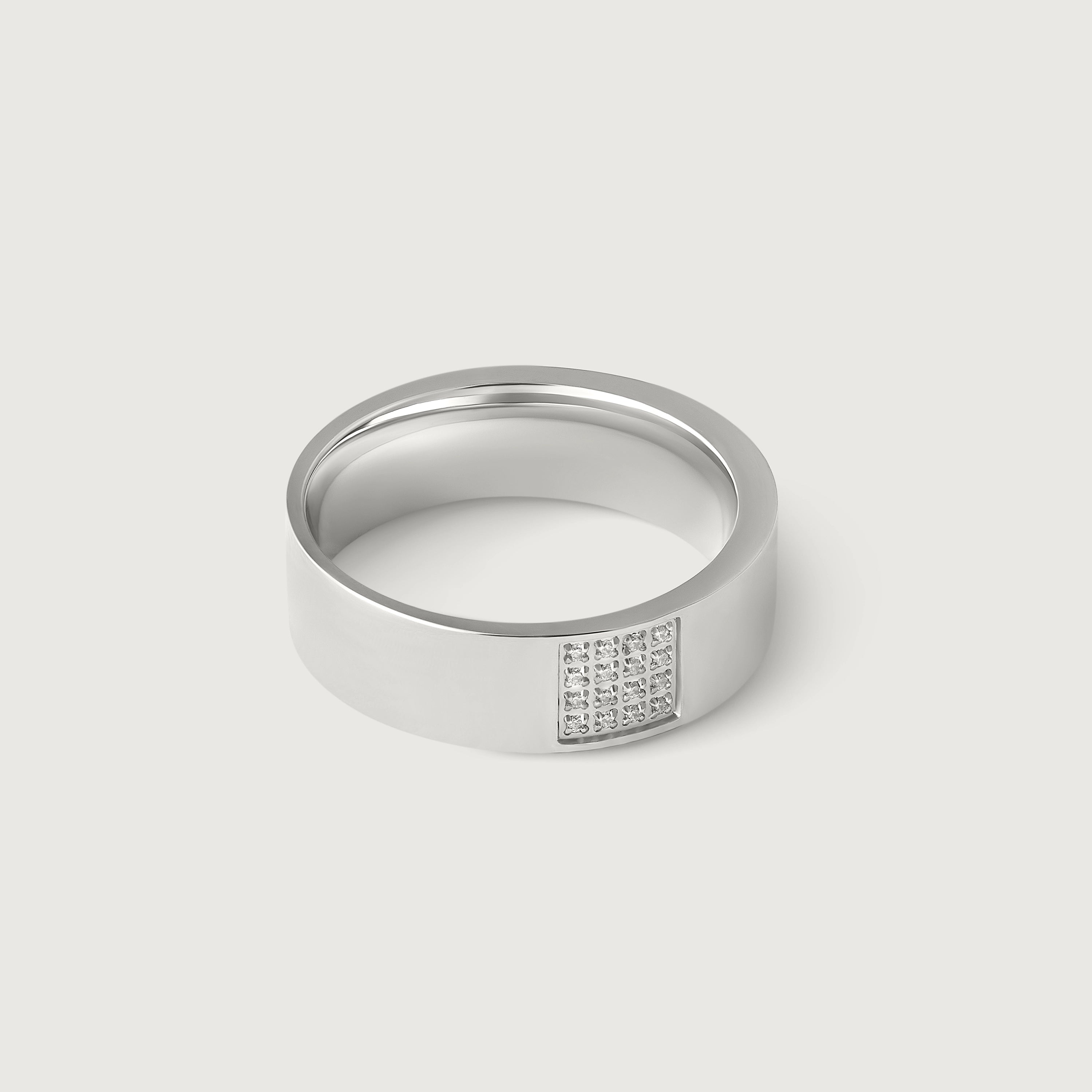 A silver ring with a rectangular accent paved with sparkling cubic zirconia stones, displayed against a white background.