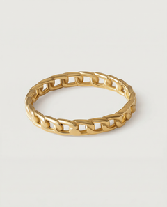 A gold-plated ring with a chain-inspired design, displaying a sleek, polished surface.