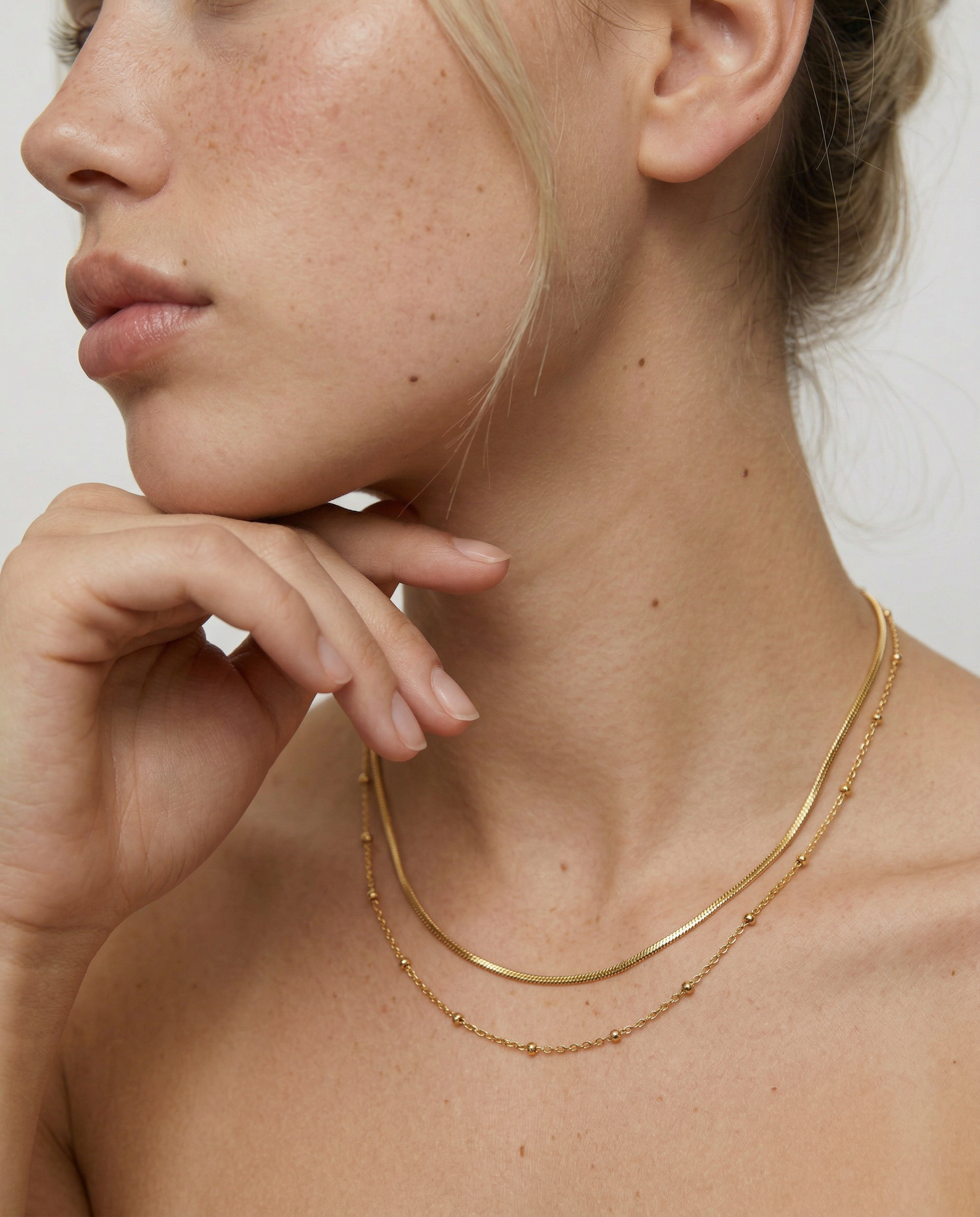 model wearing a delicate two layer gold plated 18k necklace