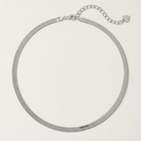 A  sterling silver snake chain necklace with an adjustable length and a heart charm