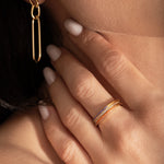 close up of a model wearing 3 beautifully coloured band rings