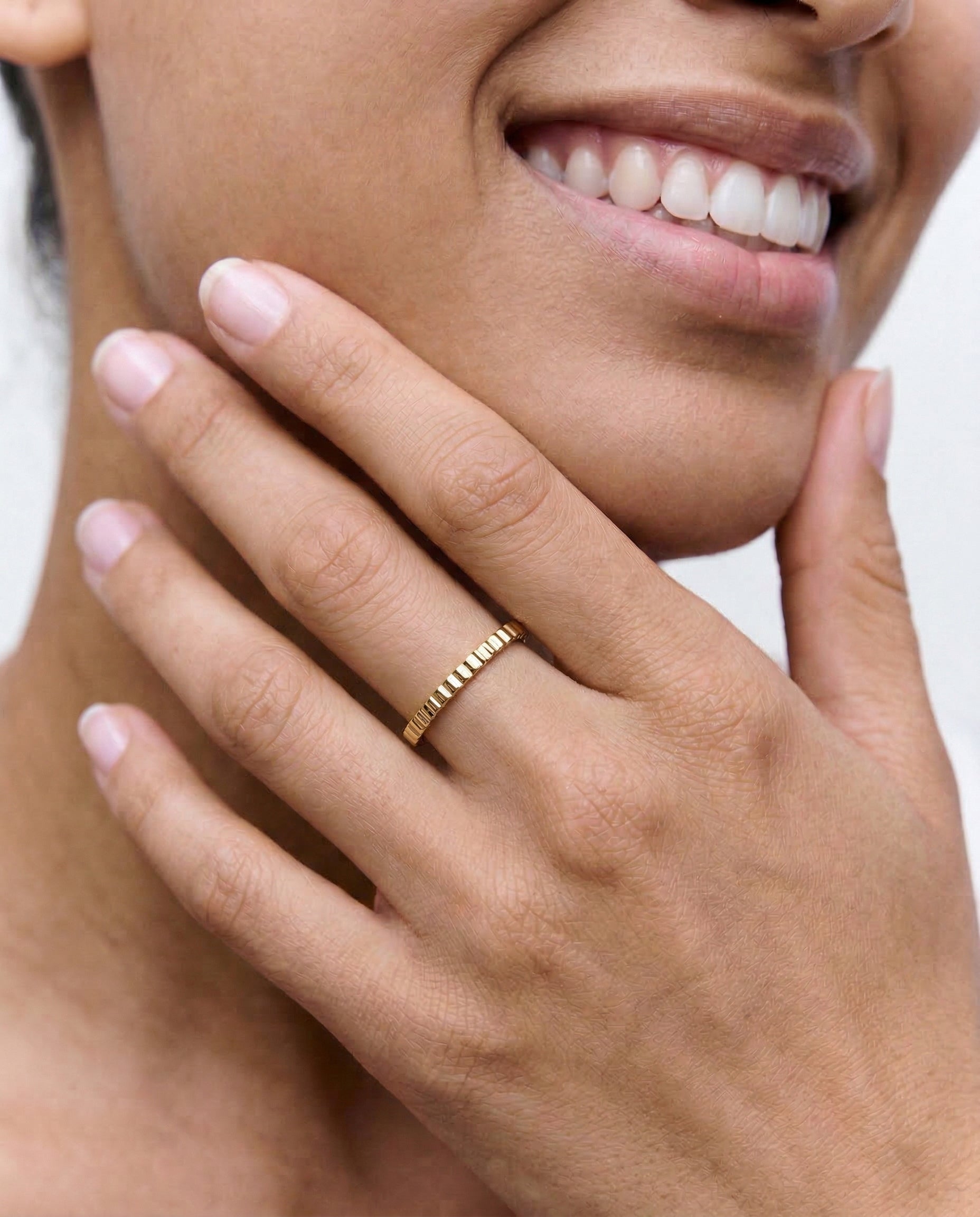 close up of a model wearing a 18k gold plated 2mm ring