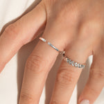 close shot of a model wearing 2 sleek sterling silver rings from Kaleya Studio