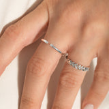 close shot of a model wearing 2 sleek sterling silver rings from Kaleya Studio