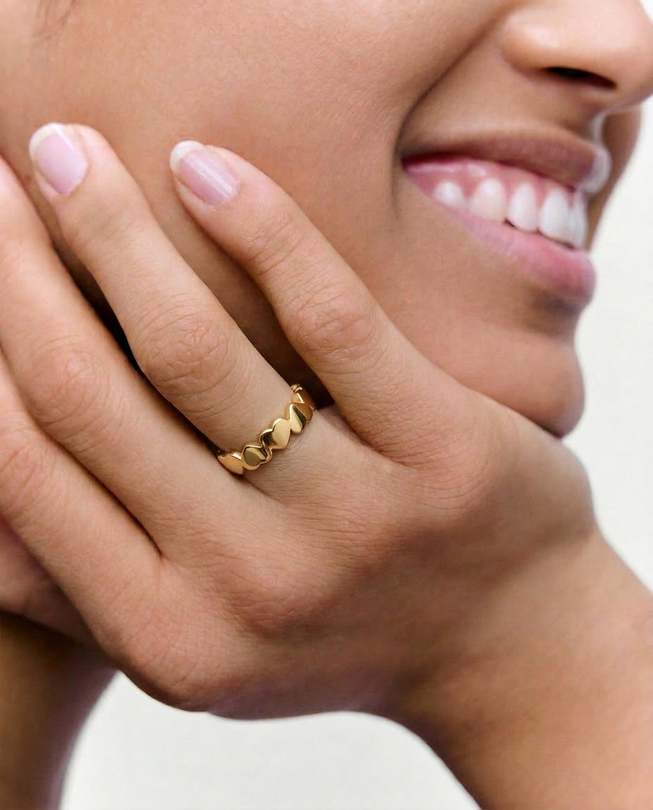 close picture of a model wearing hears ring