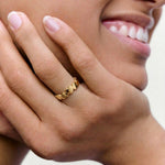 close picture of a model wearing hears ring