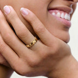 close picture of a model wearing hears ring
