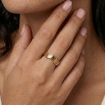 model wearing a wavy gold ring
