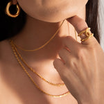model wearing bold and statement gold plated jewellery