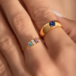 close up of a model hand wearing a delicate cocktail and a statement ring
