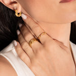 close up of a model wearing 18k gold plated jewellery