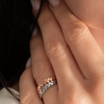 close up of a model wearing the zaria ring from Kaleya Studio in sterling silver and rose