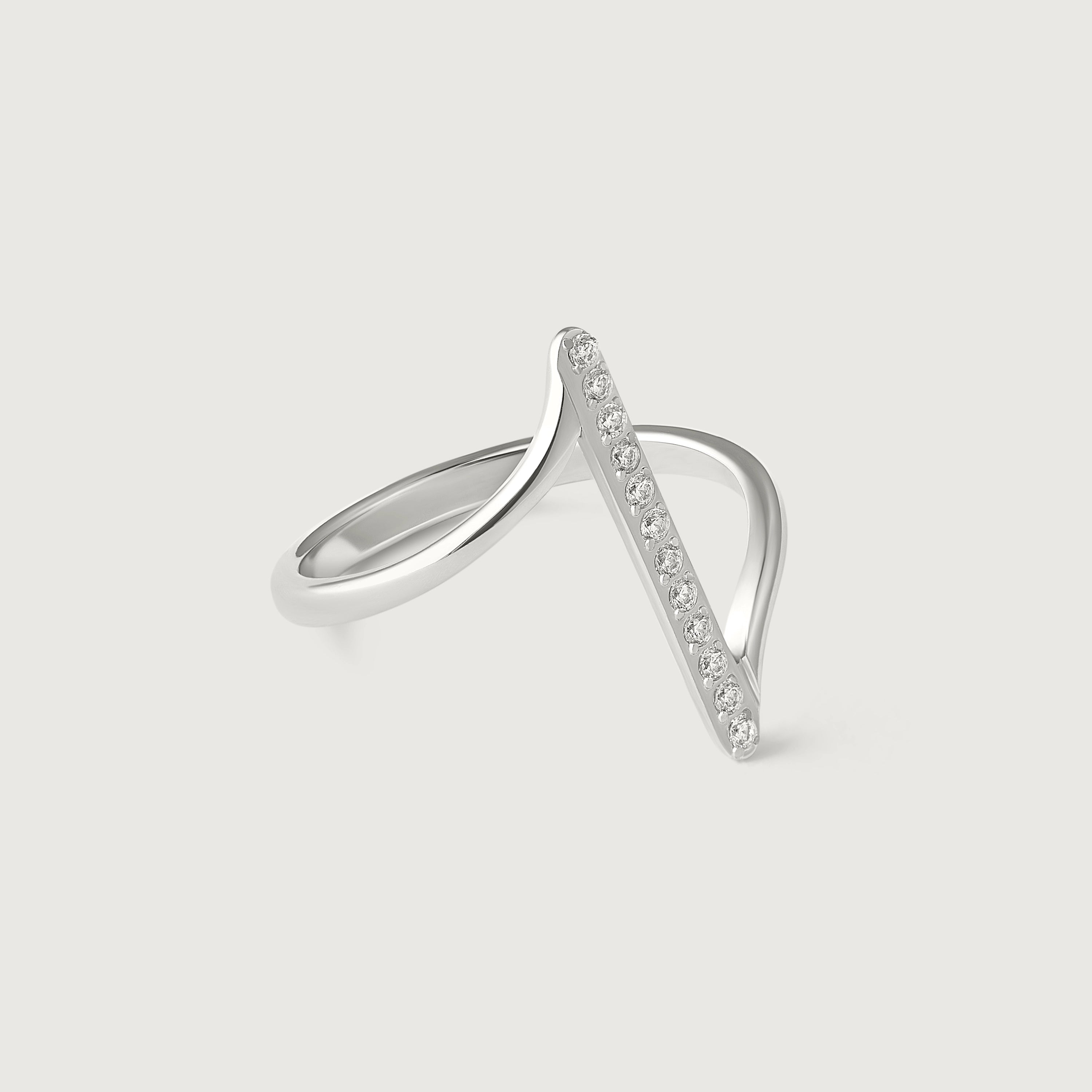 A sterling silver ring with a lightning bolt design adorned with cubic zirconia stones, displayed against a white background.