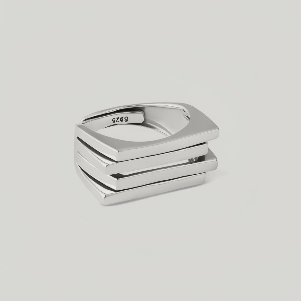 video of a silver ring with a bold, architectural design consisting of layered silver plates.