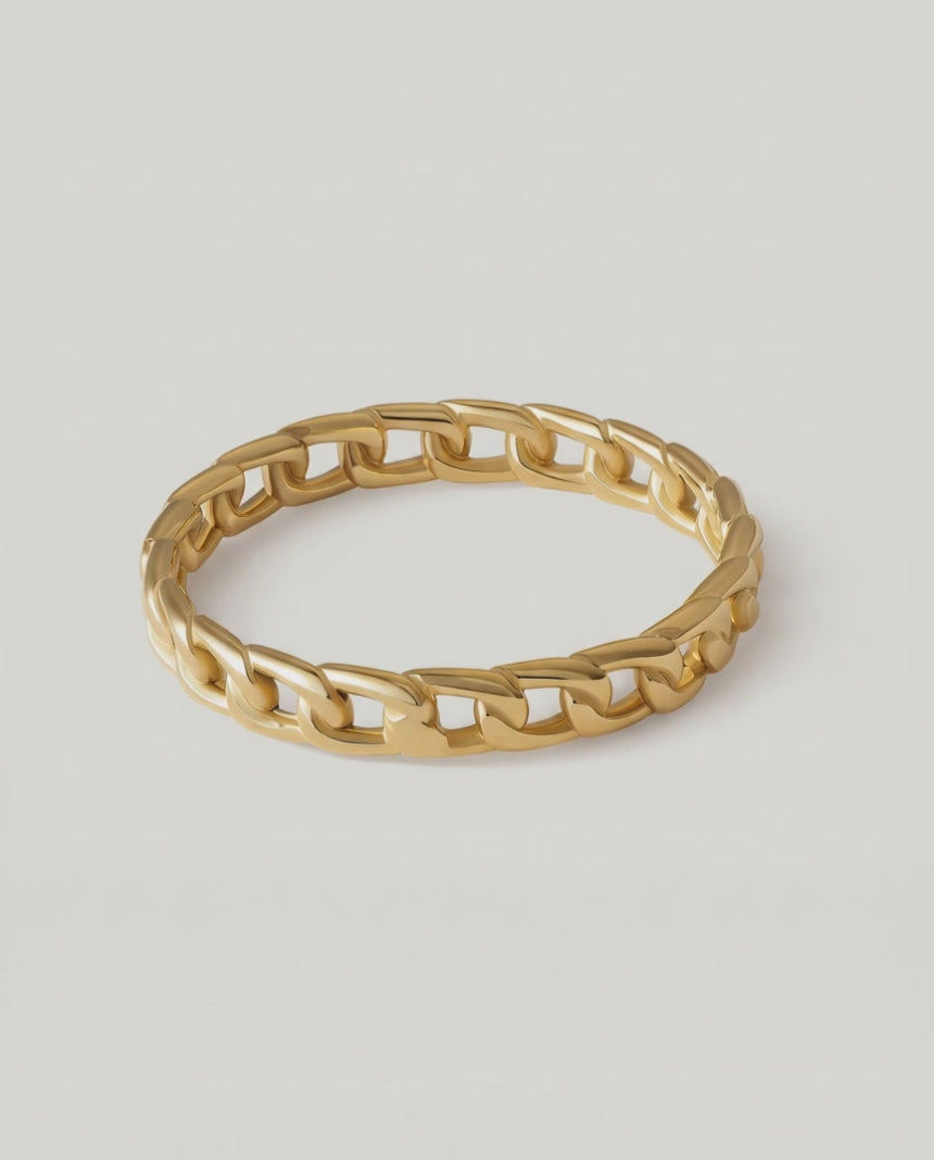360 rotating video of a gold-plated ring with a chain-inspired design, displaying a sleek, polished surface.