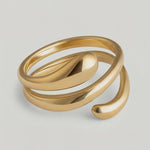 360 video of a gold-plated stainless steel ring with an architectural, coiled design