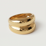 A gold-plated ring with a smooth, curved design 