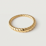 A gold-plated metal ring with a twisted rope design, displayed against a white background.