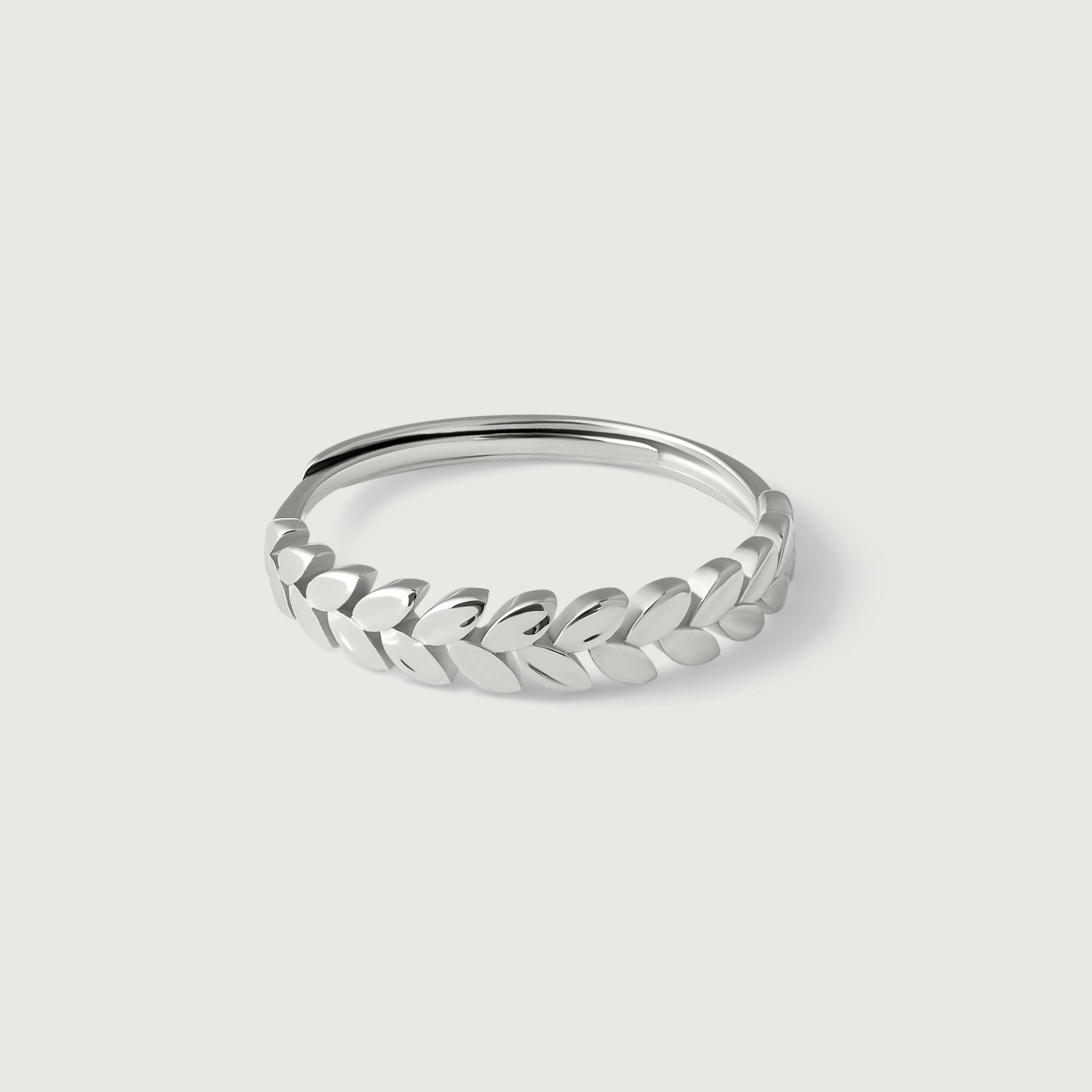 A sterling silver laurel leaf band ring with a polished finish, featuring a series of leaves encircling the finger.